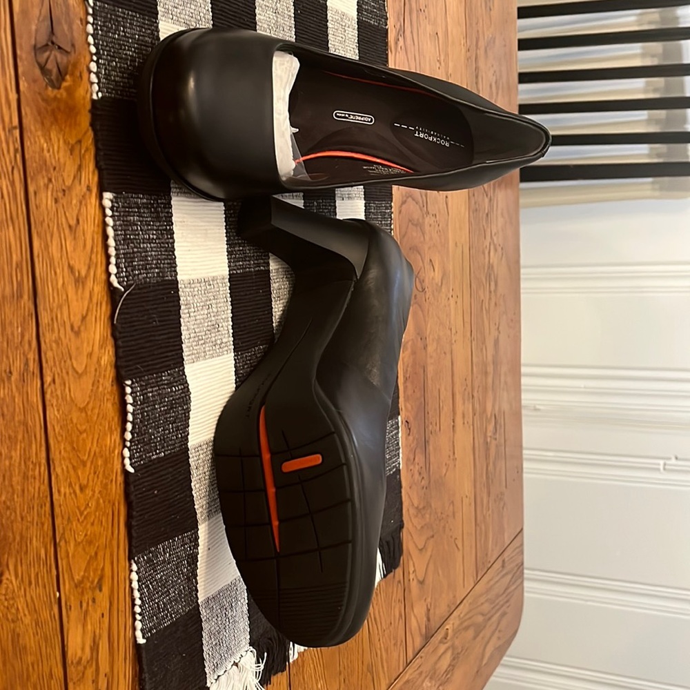 Brand new in box Rockport, Total Motion, 3-inch, black pumps. Size 9